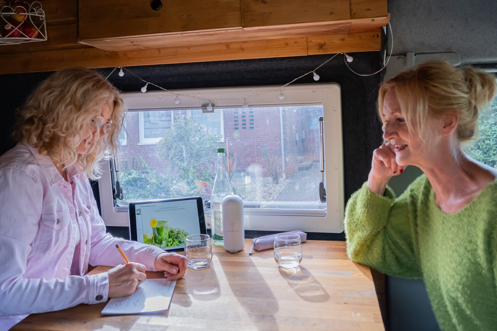 two women sitting at a table